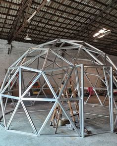 a large metal structure sitting inside of a building