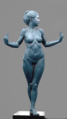 a statue of a woman with her hands in the air