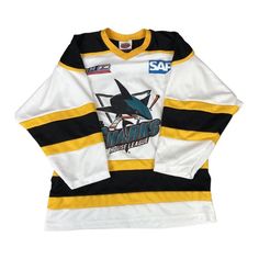 a hockey jersey with the san jose sharks logo on it and black and yellow stripes