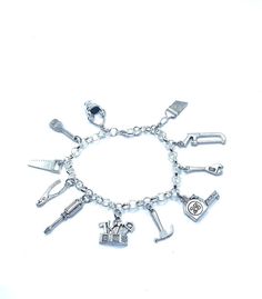 "New. This Bracelet makes a perfect gift  has 11 Handyman Handywoman themed Charms Stainless Steel bracelet has a lobster clasp closure measures approx 8\" bracelet and charms are silver tone alloy and steel." Tools Theme, Handy Woman, Construction Tools, Bracelets And Charms, Steel Bracelet, Stainless Steel Bracelet, Bracelet Making, Lime Green, Lobster Clasp