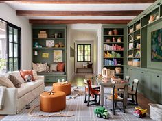 a living room filled with furniture and bookshelves