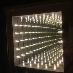 a lighted display case with many lights on it