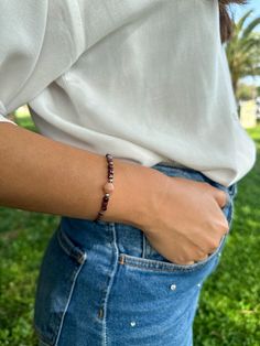 Find your anchor in the midst of life's storms with our Stability bracelet, a powerful blend of Rhodonite, Garnet, Obsidian, and Sunstone, designed to ground you in strength and resilience. Rhodonite: A stone of emotional balance, Rhodonite's gentle energy helps you heal from past traumas and face the future with courage. Garnet: Symbolizing strength and endurance, Garnet's fiery energy empowers you to overcome any obstacle. Obsidian: A stone of protection, Obsidian shields against negativity, helping you to release fear and find solace in the present. Sunstone: Radiating optimism and joy, Sunstone uplifts the spirit and guides you towards a hopeful, abundant future. These powerful gemstones provide stability and strength, helping you weather life's storms. Wear the Stability bracelet and Release Fear, Emotional Balance, Spiritual Connection, Garnet, The Future, Energy, Bracelet, Gemstones, Stone