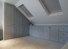 an attic bedroom with lots of storage space