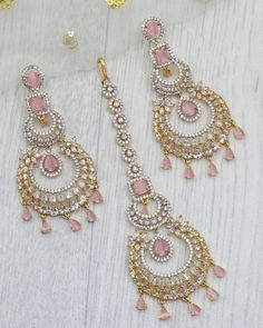 American Diamond CZ Chendalier Earrings and Maang Tikka Set are the ultimate in versatile  Indian jewelry. Wear them together or Tikka and Earrings Their own. you can create three different looks with one set.  Dimension of Earrings: L8cmxW4cm Choose from: Gold and Silver This gorgeous pair is made on brass as base metal and handcrafted to perfection with studded white , CZ stones, and Mint Green semi precious stone Droplets. you don't have to opt for the minimalistic all the time. Sometimes it's better to go OTT. Tikka And Earring Set, Maang Tikka Set, Punjabi Jewelry, Tikka Jewelry, Modern Mehndi Designs, Gold Jewelry Simple Necklace, Jewelry Set Design, Bridal Accessories Jewelry, Maang Tikka