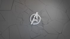 the avengers logo is displayed on a wall