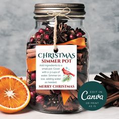 a glass jar filled with orange slices and cinnamon sticks