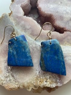 Make a statement with these gorgeous blue lapis dangle earrings. One of a kind and made with all gold filled metals. Gold filled is a metal made to last and just one step down from solid gold. No tarnishing and easy to clean to bring back to its shine!  Gorgeous long lapis lazuli statement earrings! Hang length is 1 1/2" Blue Natural Stone Earrings As Gift, Blue Lapis Lazuli Drop Earrings, Blue Lapis Lazuli Teardrop Earrings, Blue Teardrop Lapis Lazuli Earrings, Blue Lapis Lazuli Earrings, Lapis Lazuli Dangle Earrings For Pierced Ears, Lapis Lazuli Dangle Earrings With Natural Stones, Blue Lapis Lazuli Jewelry With Ear Wire, Blue Lapis Lazuli Earrings For Gift