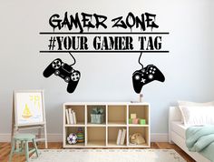 a wall decal that says gamer zone with two video game controllers