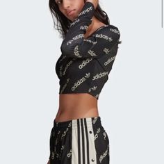 Adidas Black Logo Long Sleeve Crop Top. Size M. Brand New. Chic Black Tops For Streetwear, Adidas Tops With Graphic Print For Fall, Adidas Stretch Long Sleeve Tops, Adidas Long Sleeve Tops For Spring, Adidas Long Sleeve Spring Tops, Sporty Black Tops For Spring, Sporty Black Top For Spring, Black Stretch Adidas Tops, Trendy Fitted Adidas Tops