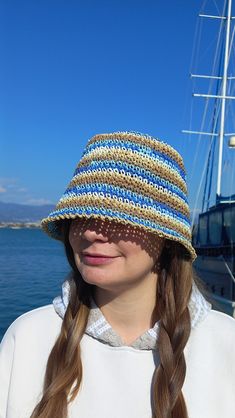 Stylish Straw Striped Crochet Summer Hat For Beach Holiday, Vacations, Travel, Sun Protect Raffia Woman Bucket Hat Bucket Raffia Hat your best friend for summer. Raffia eco- friendly materials.  Hat weight is about 100 grams. It fits easily into a travel ag for travel.  The hat is breathable, you will feel comfortable on the beach and will provaid reliable protection from the sun. Hat size: for head circumference 55-56 cm, 21,6-22 inches. You an contact me to order the size you need. The hat can Brown Crochet Bucket Hat For The Beach, Lightweight Blue Straw Hat For Beach, Blue Woven Straw Hat For Beach, Bohemian Yarn Sun Hat For Beach, Bohemian Yarn Sun Hat For The Beach, Woven Yarn Sun Hat For Vacation, Bohemian Sun Hat For The Beach, Brown Yarn Bucket Hat For The Beach, Yarn Straw Bucket Hat For Beach