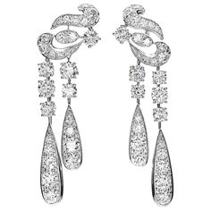 An incredible pair of Graff earrings designed in a swirl motif and suspending diamond drops with the finest Graff round diamonds weighing appx 10.65cts. The earrings are mounting in shimmering 18k white gold and measure 2.37" in length by 1/2" wide. Graff Jewelry, Graff Diamonds, Pearl Chandelier Earrings, Diamond Chandelier, Bridal Jewels, Diamond Jewelry Designs, Art Nouveau Jewelry, Expensive Jewelry, White Gold Earrings