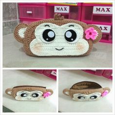 the monkey purse is made with crochet and has pink flowers on its head