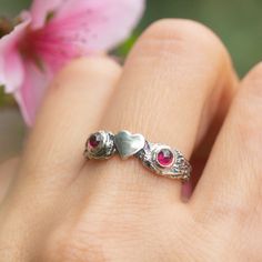 "This cute heart ring is crafted from sterling silver and features a tiny heart on a twig-like band, with two garnet stones completing the look. It's a dainty and delicate romantic piece that will make a great gift for someone special, and is the perfect love symbol to express your feelings. Whether you're looking for a witchy wedding ring, a branch promise ring, or a lifelong heart ring, this is the perfect accessory for any look. Express your love with this timeless and elegant piece. Hand-crafted using the lost wax technique, it's perfect for nature and wilderness lovers. Show your love with this cute Love ring.  Made to order by size and stone, this ring will be a beautiful addition to any jewelry collection Measurements and details: * Size:   The ring width on the front side - 0.2\" ( Unique Heart-shaped Promise Ring, Silver Heart-shaped Ruby Promise Ring, Unique Promise Rings For Valentine's Day, Unique Rings For Promise Ring On Valentine's Day, Sterling Silver Heart Ring With Birthstone For Promise, Sterling Silver Open Heart Promise Ring, Handmade Sterling Silver Promise Heart Ring, Handmade Sterling Silver Heart Promise Ring, Handmade Sterling Silver Heart Ring For Promise