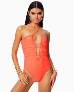 The Marta One Piece is a striking swimsuit that loves long walks on the beach, daiquiris and big sun hats. Featuring a self tie spaghetti strap at the top and back, as well as two elastic tunnels along the bust and waist, this sexy number can be tied multiple ways or worn strapless. The flattering deep v and shirring create a silhouette that's flattering on everyone. White is a Ramy Brook color exclusive. Nylon Spandex Machine or hand wash. Hang dry or tumble dry low. Model is wearing Size XS Mo Big Sun Hat, Strapless One Piece, Brooks One Piece, Plunging One Piece Swimsuit, Cut Out One Piece, Floral One Piece Swimsuit, Green Swimsuit, Halter One Piece Swimsuit, Ramy Brook