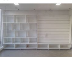 empty white shelves in an empty room