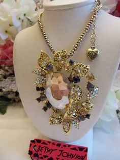 BETSEY JOHNSON LOVELY GOLDEN CENTER RHINESTONE FLORAL ARRAY PENDANT NECKLACE | eBay Gold Jeweled Crystal Necklace In Costume Style, Elegant Gold Metal Flower Necklace, Glamorous Gold Jeweled Crystal Necklaces, Vintage Gold Crystal Pendant Necklace, Vintage Gold Pendant Crystal Necklace, Glamorous Jeweled Crystal Necklaces For Gifts, Glamorous Jeweled Crystal Necklace For Gift, Gold Flower Pendant Costume Necklace, Glamorous Gold Crystal Necklace For Gift