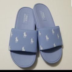 From Polo Ralph Lauren, Striped Detail Slides Feature: Synthetic Upper Slip-On Construction Synthetic Lining Eva Outsole Light Blue Synthetic Slides With Round Toe, Cute Slip-on Slides For Spring, Cute Spring Slip-on Slides, Light Blue Flat Slides For Spring, Light Blue Flat Casual Slides, Light Blue Casual Slides For Spring, Casual Light Blue Slides For Spring, Casual Light Blue Flat Slides, Spring Light Blue Flat Slides