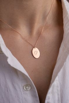 This rose gold initial disc necklace is a dainty and personalized piece, perfect for adding a subtle, elegant touch to any outfit. Custom engraved with your initial, it makes a meaningful gift for any occasion, whether it’s for a birthday, anniversary, or a simple “just because” moment. Its minimalist design makes it an everyday essential that never goes out of style.  modern gold jewelry, charm necklace, personalized necklace for mom, fall jewelry, dainty necklace, gold aesthetic, everyday necklace, elegant style, minimalist jewelry, gold jewelry necklace Minimalist Jewelry Gold, Dainty Necklace Gold, Custom Charm Bracelet, Rose Gold Initial, Initial Disc Necklace, Mom Fall, Necklace For Mom, Engraved Pendant