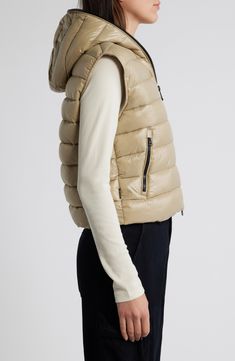 Whether you're deep in the backcountry or just your own backyard, you'll appreciate the cozy core warmth and weather-shedding dryness of this vest filled with lofty synthetic-down insulation. 20" length (size 3) Two-way front-zip closure Fixed hood Front zip pockets Wind resistant Lined, with 100% polyester fill 100% nylon Machine wash, line dry Made in China Cozy Core, Hooded Puffer Vest, Save The Duck, The Duck, Puffer Vest, Repellent, Water Repellent, Insulation, Zip Pockets