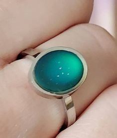 This is a beautiful mood ring. Changes color with your mood. Band is stainless steel which will never tarnish, rust, or change color. And is hypoallergenic! Pair up with any of my name rings. I ship out in 1-2 business days and guarantee customer satisfaction. Green Stainless Steel Ring As A Gift, Green Stainless Steel Rings As Gifts, Green Stainless Steel Rings For Gifts, Green Stainless Steel Ring For Gift, Retro Green Ring As Gift, Retro Green Ring For Gift, Mom Rings Stackable, Mood Rings, Real Mood Ring