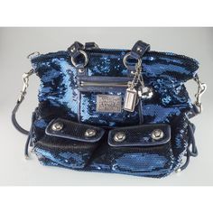 Coach Poppy Blue Sequin Spotlight Purse w/ Disco Ball Bag Charm XL Gorgeous Sequin Poppy Purse by Coach Features a Number of Silver Elements, a Tag Zipper, and a Disco Ball Bag Charm 12" Wide 13" Long 3" Deep Overall purse is in good condition. Some minor wear on leather elements and other minor signs of use on interior. See photos for details. Reference Item #A07122204C JP 12/16/22 Louis Vuitton Key Holder, Coach Bags Outlet, Cheap Coach Bags, Coach Tote Bags, Coach Poppy, Black Leather Tote Bag, Bags Coach, Coach Shoulder Bag, Black Leather Tote