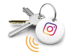 a keychain with the instagram logo on it and two keys attached to it