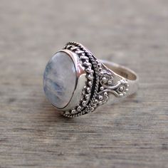 Gemstone - Natural Rainbow Moonstone Gemstone Size - 12x16 mm oval Metal - Sterling Silver natural AAA rainbow moonstone set with a sterling silver handmade ring Each Ring made with Precision and love, these rings are perfect for everyday use and a perfect accessory to wear at work. Rings can be customized on request and gemstone can be switched to any other as per requirement. Other beautiful designs uploaded with fabulous gemstones. kindly visit my store to view the complete collection. Feel f Oval Crystal Ring With Natural Stones For Wedding, Silver Oval Moonstone Ring Gift, Silver Oval Cabochon Moonstone Ring For Wedding, Silver Oval Moonstone Ring For Wedding, Adjustable Oval Moonstone Ring For Weddings, Bohemian Oval Cabochon Moonstone Ring, Adjustable Oval Moonstone Wedding Ring, Spiritual Silver Oval Moonstone Ring, Silver Oval Moonstone Ring With Natural Stones