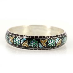 Flower Pattern Enamel Bangle for women, Floral Bangle, One of Kind Bangle, Top Trending Enamel Bangle, Meenakari Bangle from India, Product Details : Metal : 925 Solid Sterling Silver Designer Enamel Bangle inspired by nature. Bangle Width : 14 mm Approx Bangle Inner Diameter : 62 mm Approx Bangle Weight : 36.300 Grams Approx Style :  Enamel Jewelry  Note : All the enamel is hot enamel and purely handmade, if it falls from height there may be chance of breakage in enamel. All the designs are crafted by londonjewellers, its our original designs and mostly of them are ready in the stock, we are using Pure 925 (Stamped) Sterling Silver with Gemstones, our jewelry designs are Handmade. We are adding new creative designs in our shop regularly, for new handmade stuff please visit our shop : http Meenakari Jewelry Bracelet, Traditional Flower Shaped Bracelets, Traditional Flower Shaped Jewelry, Ceremonial Cuff Bracelet For Festivals, Bohemian Meenakari Bangle, Ceremonial Festival Cuff Bracelet, Traditional Adjustable Enamel Bracelets, Traditional Silver Enamel Bangle, Traditional Multicolor Enamel Bracelets