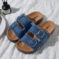 Step into comfort and style with the Roxoni Women's Comfort Flat Sandals. These sandals are designed to provide all-day ease with a chic touch, perfect for any casual outing.

- **Size**: 8
- **Color**: Blue
- **Material**: Suede
- **Gender**: Female
- **Features**: Double buckle adjustable straps, EVA flat-slide footbed, open toe design with straps and fringes

Crafted with a soft suede material that feels gentle against the skin, these sandals feature an adjustable double-buckle design that al Casual Flat Slippers With Buckle Closure, Trendy Beach Slip-on Footbed Sandals, Trendy Slip-on Footbed Sandals For Beach, Casual Blue Sandals For Summer, Flat Heel Footbed Sandals With Buckle Closure For Beach, Summer Flat Heel Slippers With Buckle Closure, Blue Slippers For Spring Vacation, Trendy Sandals With Buckle Closure For Beach Season, Trendy Buckle Closure Sandals For Beach Season