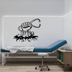 a hospital room with a bed and wall decal