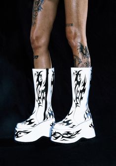 Attack at night in these reflective knee high platform boots that have rubber treaded soles, side zip closures, and a tattoo print all over. Rave Platform Boots, Synthetic Knee-high Platform Boots For Streetwear, Grunge Knee-high Platform Boots For Concerts, Holographic Platform Boots, Rave Boots, Thigh-high Platform Boots For Streetwear, Mark Of The Beast, High Platform Boots, Knee High Platform Boots