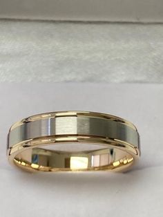 two tone gold wedding band with white and yellow stripes