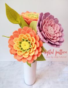 three colorful flowers in a white vase on a marble counter top with text overlay that reads, digital pattern step by step