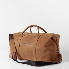 Impeccably crafted from high quality leather or suede, the Graham Leather Collection is filled with classic styles for work and travel. Designed with a place for everything you need for a weekend away, this overnighter features both carrying handles and an adjustable shoulder strap. Add a monogram to for a unique touch.    22"w x 9.75"d x 11"h  Made from leather or suede with a soft cotton lining.  Please see Product Information for more details.  Made in Turkey.  Camel: Monogramming is foil or blind debossed.  Chocolate: Monogramming is foil debossed. Luxury Leather Luggage With Adjustable Strap, Classic Camel Satchel, Luxury Cognac Weekender Bag For Everyday, Leather Luggage With Luggage Sleeve, Casual Everyday Leather Luggage, Luxury Leather Camel Satchel, Luxury Camel Leather Satchel, Luxury Leather Satchel In Camel, Classic Leather Everyday Travel Bag