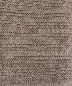 a close up view of the texture of a knitted material, with small ridges