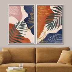 two paintings hanging on the wall above a couch