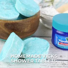 homemade vicks shower tablets in a wooden bowl next to a jar of yogurt