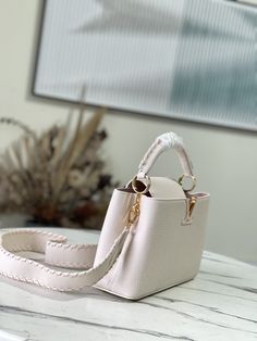 Creamy white with light pink webbing style This Capucines BB handbag focuses on exquisite craftsmanship Taurillon leather bag body and handle and shoulder strap color details reflect contrast Metal texture leather wrapped V letter Capucines series flap can be external or adduction. 

Size:27*18*9cm Louis Vuitton Yayoi Kusama, White Louis Vuitton, Louis Vuitton Capucines, Large Cosmetic Bag, Lv Purse, Lv Shoes, Medium Handbags, Small Handbag, Louis Vuitton Pochette