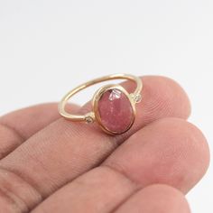 > Material - 18K Solid Yellow Gold  > Gemstone - Natural Pink Tourmaline & Diamond > Gemstone Weight- 1.800 ct > Diamond Weight- 0.050 ct > Gross weight - 2.27 grams Tourmaline helps to create a shield around a person or room to prevent negative or unwelcome energies from entering. It is also grounding and helpful to balancing all of the chakras. The stone can even dissolve challenging energy and negative thought patterns, transmuting them into more beneficial energy and beliefs. You can also go to my shop Home for more:  https://www.etsy.com/shop/TheJewelVine We offer free resizing, and any customization is welcome. A satisfied customer is our top priority, and we try our best to make these timeless pieces for you. Please contact me for any queries at- RAJSHREE  AGARWAL +91 9602154369 jew Tourmaline Bezel-set Oval Cabochon Ring, Tourmaline Bezel Set Ring In Oval Cabochon, Tourmaline Ring With Bezel Setting In Oval Cabochon, Gold Oval Tourmaline Ring, Oval Tourmaline Birthstone Ring, Oval Tourmaline Sapphire Ring For Gifts, Thought Patterns, October Birthstone, October Birth Stone