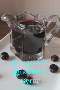 homemade blueberry syrup in a glass pitcher