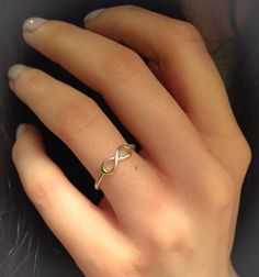 a woman's hand with a ring on it