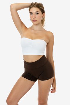 This cropped tube top featuring a ruching detail at the center and sides of the bust. This casual top can be dressed up or down with jeans, shorts and other accessories. Made in Los Angeles, Calif. Our experienced seamstresses earn an average up to $20 an hour or more and no less than $16. Plus benefits and overtime. This item is a garment dye product. Garment dye items can be distinguished by “GD” at the end of their style number, and will not match piece dye items (items without “GD” at the en Cropped Tube Top, Casual Top, Cute Tops, Tube Top, Jeans Shorts, Casual Tops, Top Styles, Dress Up, Angeles