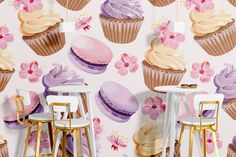 wallpaper with cupcakes and pink flowers on the background is an image of two stools in front of a table