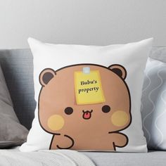 a brown teddy bear with a sticky note on it's head that says buddha's property