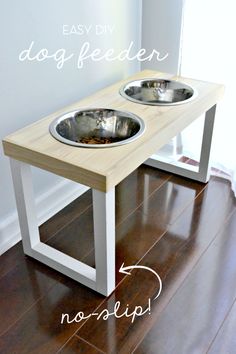 an easy diy dog feeder table with two bowls on it