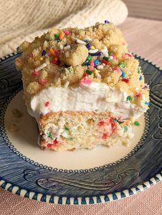 two pieces of cake with sprinkles and white frosting on a plate