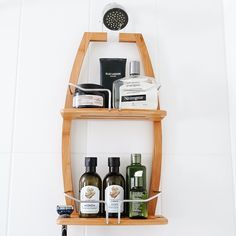 two wooden shelves holding different types of skin care products and personal care items on them