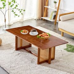 a coffee table with food on it in a living room