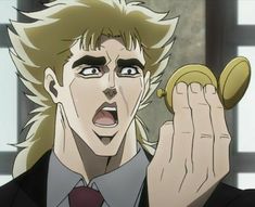 a man with blonde hair holding a banana in his hand